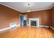 Living room with hardwood floors and a fireplace at 424 S College Ave, Newton, NC 28658