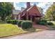 Brick home with awning and well-manicured landscaping at 424 S College Ave, Newton, NC 28658