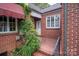 Side entrance with brick detail and tiled flooring at 424 S College Ave, Newton, NC 28658