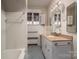 Bathroom with granite countertop and tiled walls at 424 S College Ave, Newton, NC 28658