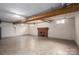 Unfinished basement with tiled floor and brick fireplace at 424 S College Ave, Newton, NC 28658