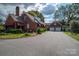 Brick house with a two-car garage and mature landscaping at 424 S College Ave, Newton, NC 28658