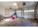 Two-car garage with concrete floor and ample storage space at 424 S College Ave, Newton, NC 28658