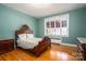 Charming bedroom with hardwood floors and antique bed at 424 S College Ave, Newton, NC 28658
