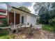 Brick patio with bistro set and adjacent storage shed at 424 S College Ave, Newton, NC 28658