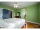 Bedroom with hardwood floors and a four-poster bed at 424 S College Ave, Newton, NC 28658