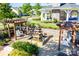 Relaxing community area with water fountain, pergola and seating at 12817 Mayes Rd, Huntersville, NC 28078