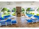 Relaxing gazebo interior with fireplace and comfortable blue seating at 12817 Mayes Rd, Huntersville, NC 28078