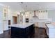 Modern kitchen with white cabinets, a large island, and stainless steel appliances at 0001 Bolton Rd, Catawba, NC 28609