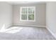 Well-lit bedroom with neutral carpeting and large window at 0001 Bolton Rd, Catawba, NC 28609