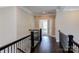 Upper hallway with dark hardwood floors and black metal railings at 0001 Bolton Rd, Catawba, NC 28609