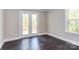 Bright bedroom with dark hardwood floors and access to a deck at 0001 Bolton Rd, Catawba, NC 28609