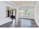 Spacious dining room featuring hardwood floors, wainscoting, and a modern chandelier at 0001 Bolton Rd, Catawba, NC 28609