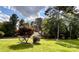Ranch home with a large yard and mature trees at 142 Scotland Dr, Mooresville, NC 28115