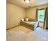 Cozy bedroom with day bed and window seat at 142 Scotland Dr, Mooresville, NC 28115