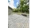 Spacious deck overlooks fenced backyard with mature trees at 142 Scotland Dr, Mooresville, NC 28115