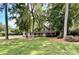 Two-story house with a large front yard and mature trees at 142 Scotland Dr, Mooresville, NC 28115