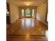 Bright dining room with hardwood floors and bay window at 142 Scotland Dr, Mooresville, NC 28115