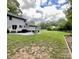 Large backyard with patio, grill, and open space at 142 Scotland Dr, Mooresville, NC 28115