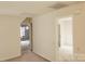 A long hallway with doors to other rooms at 4905 Benthaven Ln # 321, Charlotte, NC 28269