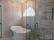 Elegant bathroom with a soaking tub and glass shower at 4905 Benthaven Ln # 321, Charlotte, NC 28269