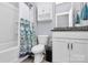 Bathroom with a shower/tub combo and white vanity at 117 Tomahawk Dr, Mooresville, NC 28117