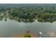 Wide aerial showcasing lakefront community and surrounding landscape at 165 Woodstream Cir, Mooresville, NC 28117