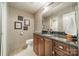 Basement bathroom with dark wood cabinets and granite countertop at 165 Woodstream Cir, Mooresville, NC 28117