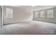 Spacious bedroom featuring carpet flooring and multiple windows providing ample natural light at 0002 Bolton Rd, Catawba, NC 28609