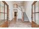 Bright entryway with hardwood floors, staircase, and double doors at 0002 Bolton Rd, Catawba, NC 28609