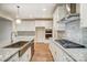 Modern kitchen with white cabinets, granite counters, and stainless steel appliances at 0002 Bolton Rd, Catawba, NC 28609