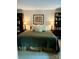 Spacious Primary bedroom with king-size bed and bookshelves at 6132 Heath Ridge Ct, Charlotte, NC 28210