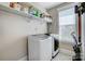 Laundry room with washer, dryer, and overhead shelving at 1507 Riverwalk Pkwy, Rock Hill, SC 29730