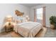 Staged main bedroom with a king-size bed, nightstands, and decorative accents at 1529 Harper Landing Blvd # 197, Stanley, NC 28164