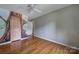 Well-lit bedroom with hardwood floors and mural at 6902 Neuhoff Ln, Charlotte, NC 28269