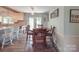 Charming dining area with wood table and chairs, adjacent to the kitchen at 8909 Highway 218 Hwy, Marshville, NC 28103