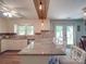 Island kitchen features granite countertops, stainless steel appliances, and hardwood floors at 8909 Highway 218 Hwy, Marshville, NC 28103