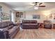 Relaxing living room with hardwood floors, leather sofas, and built-in shelves at 8909 Highway 218 Hwy, Marshville, NC 28103