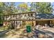 Rear exterior view of home with screened porch and garage at 201/215 Smithfield Dr, Charlotte, NC 28270