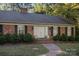 Brick front of house with double doors and landscaping at 201/215 Smithfield Dr, Charlotte, NC 28270