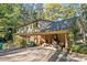 Rear view of home showing garage, porch, and landscaping at 201/215 Smithfield Dr, Charlotte, NC 28270