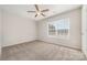 Bedroom with large window and ceiling fan at 4803 Roxfield Ln, Charlotte, NC 28215