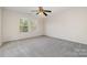 Bright bedroom with carpet flooring and ceiling fan at 4803 Roxfield Ln, Charlotte, NC 28215