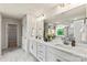 Double vanity bathroom with a large mirror and marble flooring at 124 Balboa St # 26, Matthews, NC 28104