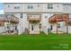 Private backyard with three townhouses, each with its own deck at 1134 Keydet Dr, Charlotte, NC 28216