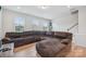 Relaxing living room with large sectional sofa and hardwood floors at 1134 Keydet Dr, Charlotte, NC 28216