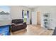 Bright bedroom with a comfy chair and access to a private bathroom at 1134 Keydet Dr, Charlotte, NC 28216