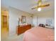 Bright bedroom with a comfortable bed, dresser, and ceiling fan at 8510 Olive Branch Rd, Marshville, NC 28103