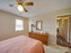 Charming bedroom with a comfortable bed, dresser and ceiling fan at 8510 Olive Branch Rd, Marshville, NC 28103