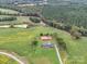 Aerial view of a house and expansive property with farmland at 8510 Olive Branch Rd, Marshville, NC 28103